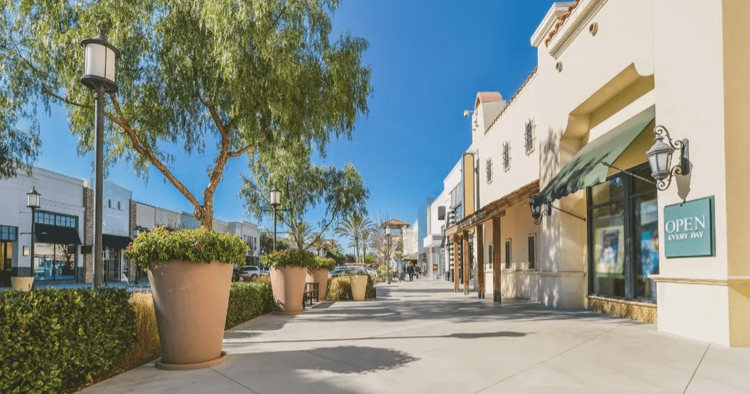 Small businesses lining a street in California.