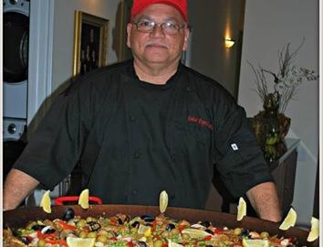 Man in front of a large bowl of food